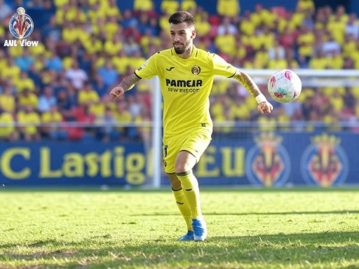 A soccer player in a yellow uniform is kicking a ball on the field during a match.