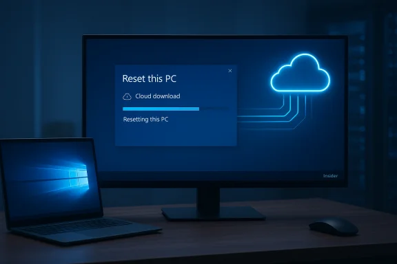 Blue-tinted desk setup with a monitor displaying Windows Reset this PC and cloud download progress.