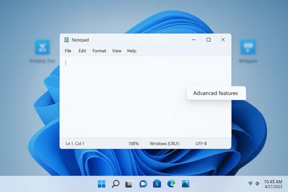 Windows 11 Notepad window open on a blue desktop background with “Advanced features” tooltip.