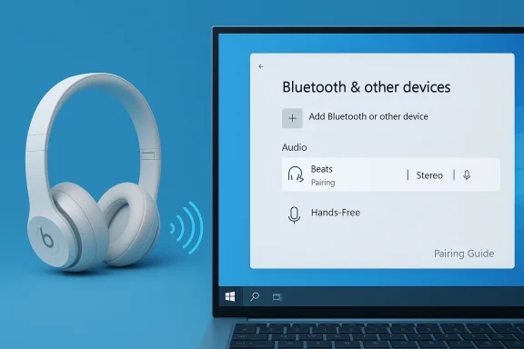 White Beats wireless headphones beside a laptop showing a Bluetooth pairing screen.
