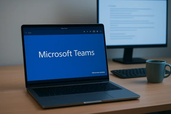 Laptop displaying Microsoft Teams on a blue screen, with a second monitor and mug on the desk.